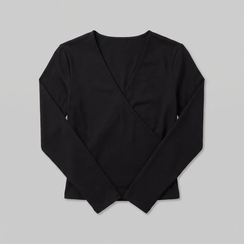 A black women's slim wrap-front long-sleeve top is shown laid flat in a standalone front view. The overlapping front panels form a surplice V neckline and cross diagonally toward the lower torso. Set-in shoulders, narrow sleeves with straight cuffs, stitched neckline and wrap-edge binding, visible shoulder seams, and a straight lower hem are visible.
