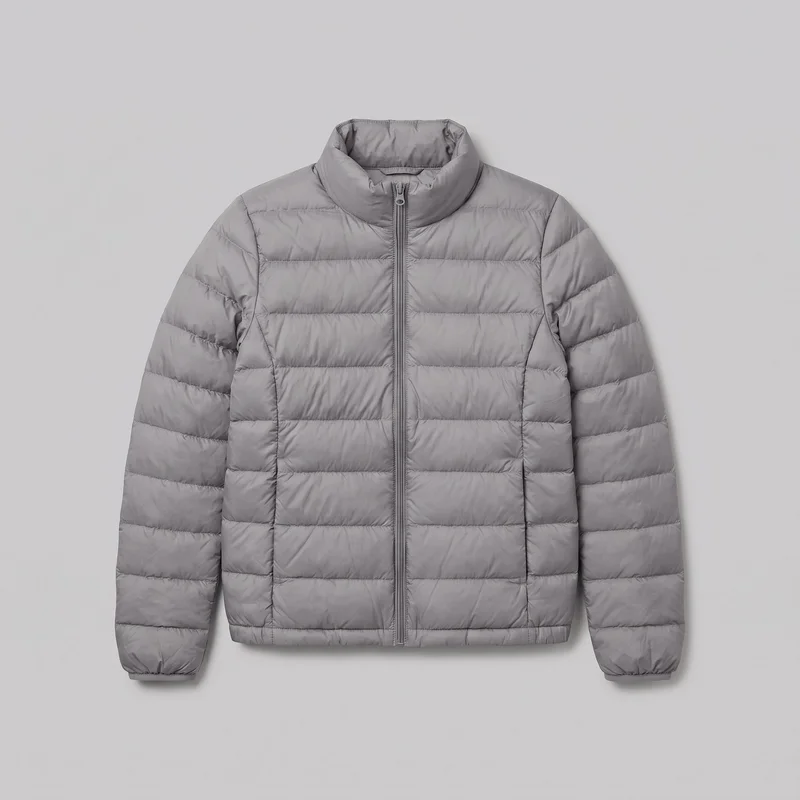 A mostly complete front view of a women's grey lightweight down jacket laid flat against a plain backdrop. The hip-length jacket has a high stand collar, full center-front zipper, long sleeves, horizontal quilted baffles across the body and sleeves, side-panel seams with two lower front pockets, gathered elastic-bound cuffs, and a straight stitched hem.