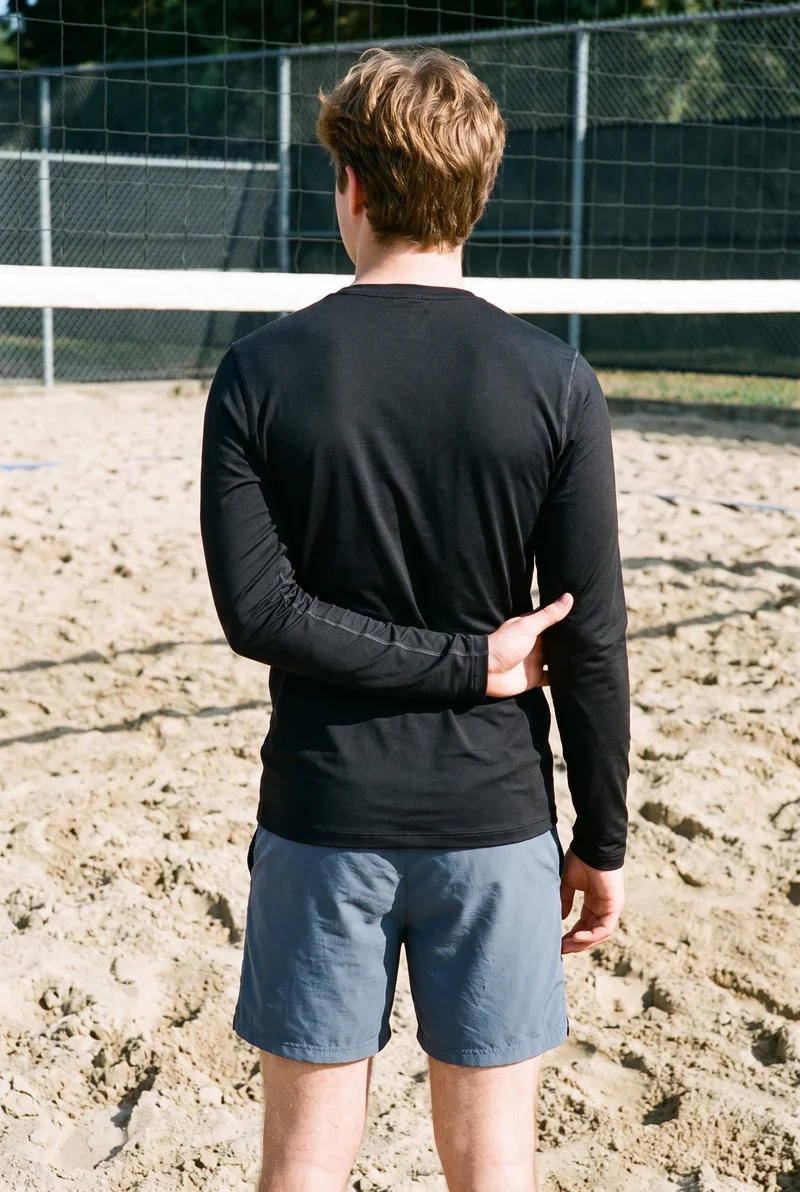 Men's Black Compression Base Layer, Three-quarter length at Back, Natural E-Commerce lighting