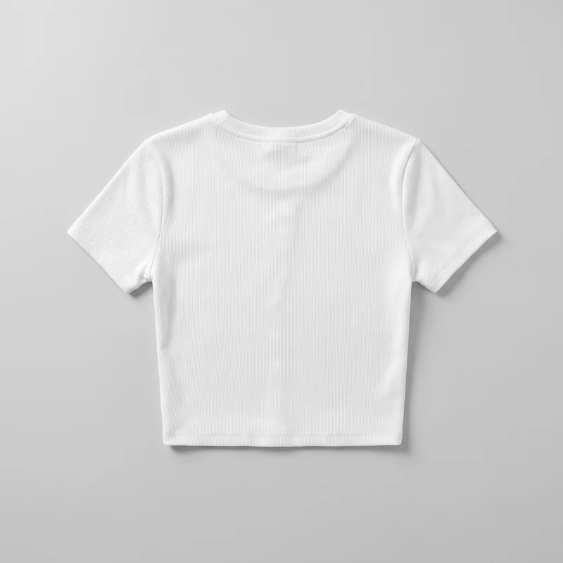 A white cropped T-shirt is shown flat as a standalone product. It has fine vertical ribbing throughout, a crew neckline with a separate neckband, set-in short sleeves, visible shoulder and armhole seams, stitched sleeve hems, and a straight stitched bottom hem.