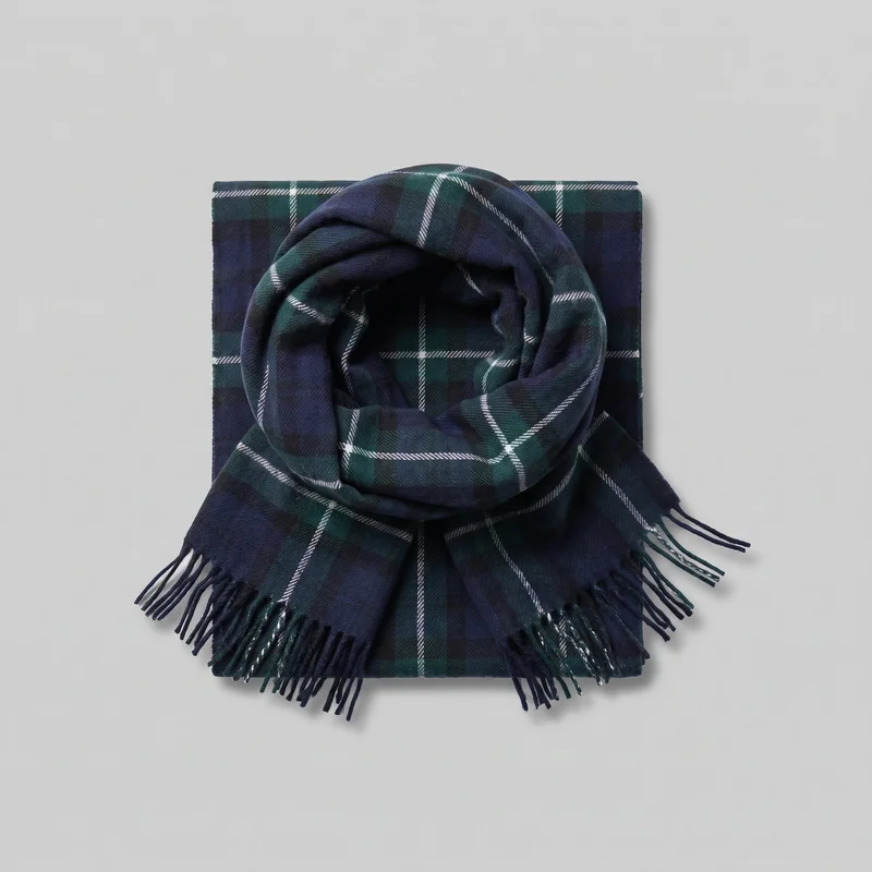 A rectangular navy wool scarf is shown folded flat with a looped portion arranged on top. It features an all-over tartan plaid pattern made of broad intersecting check blocks and thin contrasting grid lines, with short fringe tassels along the ends and straight long edges.