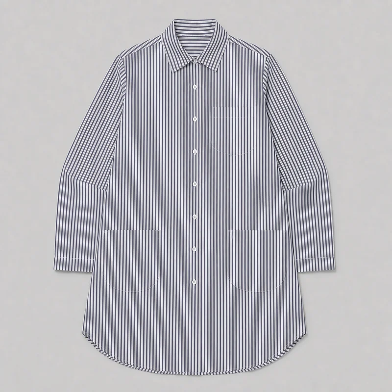 A complete front flat-lay view of a long-sleeve striped nightshirt. It has a pointed collar, full button placket, buttoned cuffs, rounded shirttail hem, contrast piping, one chest pocket, and two lower patch pockets.