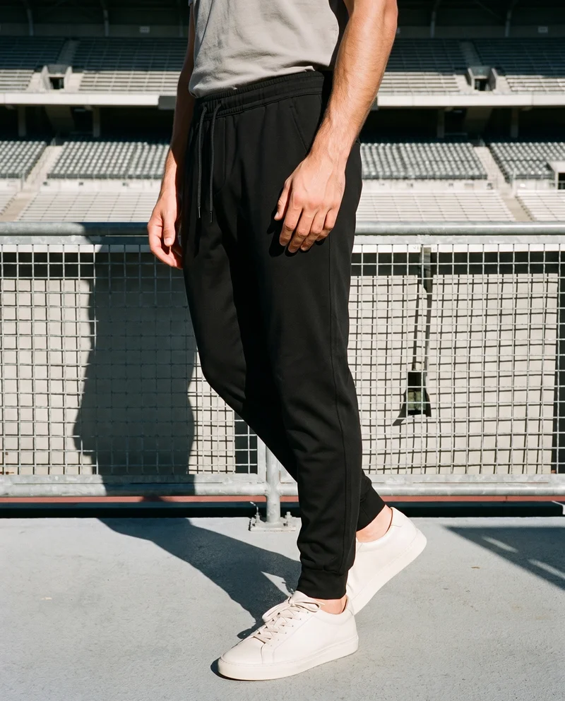 Men's Black Performance Joggers, Lower body at Three-quarter, Flash Editorial lighting