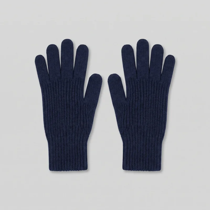 A pair of navy full-finger knit gloves is laid flat with the backs facing up. The gloves have rounded fingertips, separate thumbs, extended straight cuffs, and vertical ribbing across the cuffs and lower hand, with a finer knit texture over the fingers and upper hand.