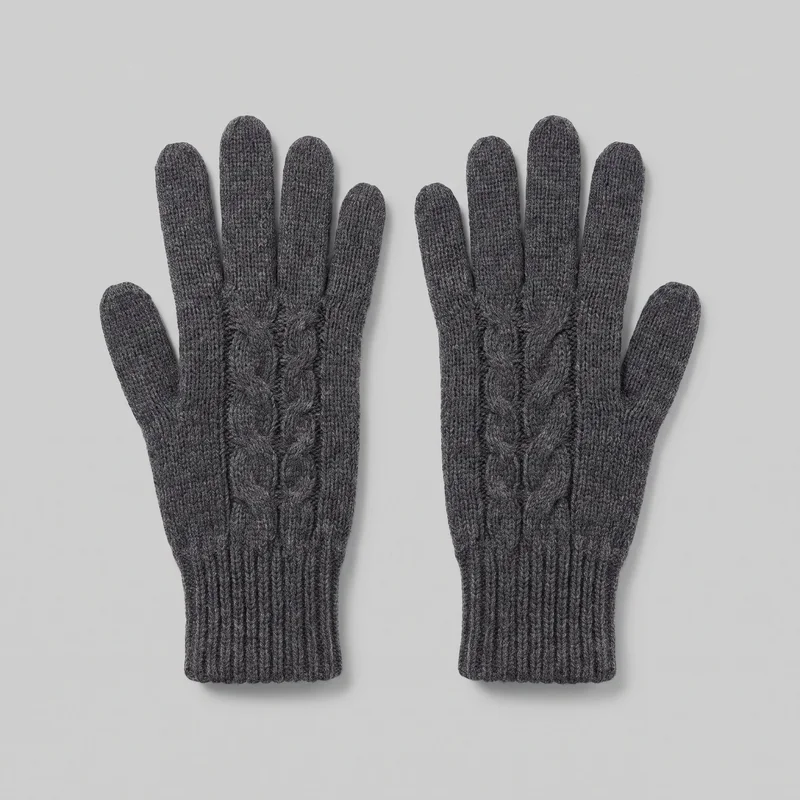 A matching pair of grey full-finger knit gloves is shown flat with the backs facing up. The gloves have rounded fingertips, separate thumbs, ribbed cuffs, and raised cable-knit panels running along the backs of the hands toward the cuffs.