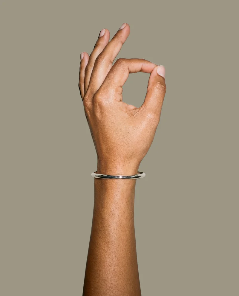 Women's Silver Cuff Bracelet, Hand and wrist at Top, Studio Cutout lighting