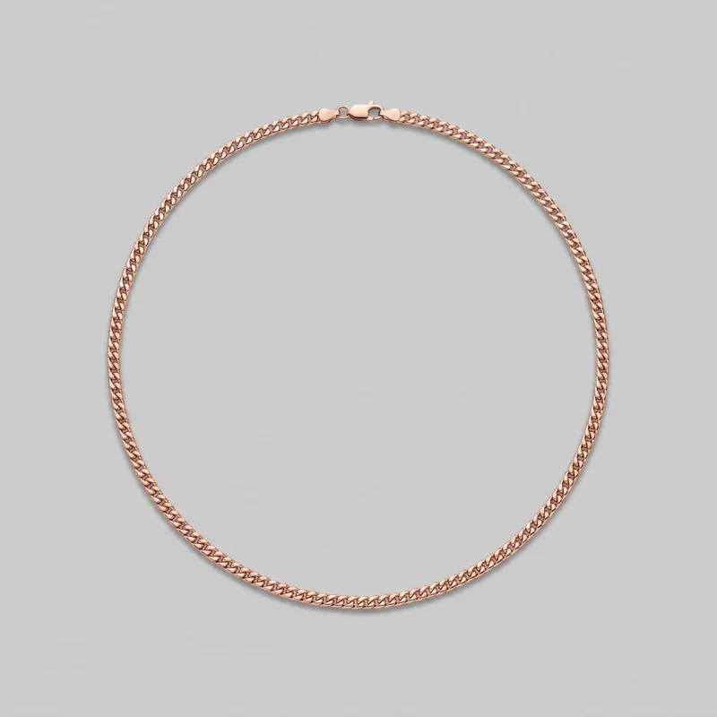 A complete men's rose gold chain is laid out in an oval. Closely interlocking flat curb links form the continuous loop, with the lobster-claw clasp, jump ring connector, and short end tabs visible at the top. The necklace has no pendant or additional embellishments.