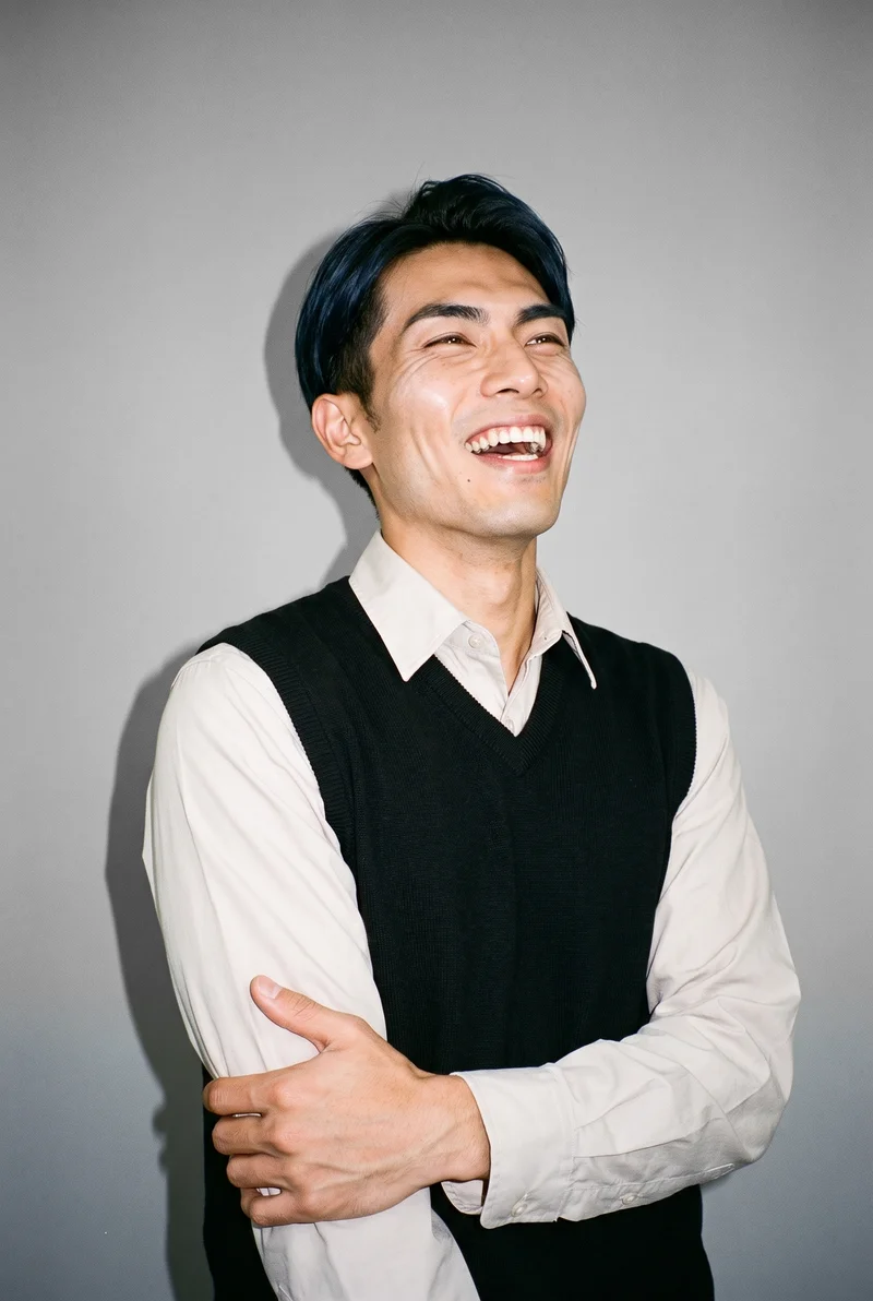 Men's Black Sweater Vest, Upper body at Three-quarter, Natural E-Commerce lighting