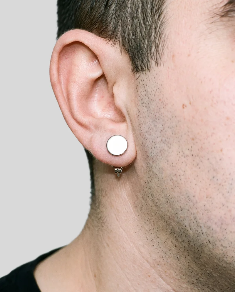 Men's Silver Stud Earrings, Ear at Side, Studio Cutout lighting