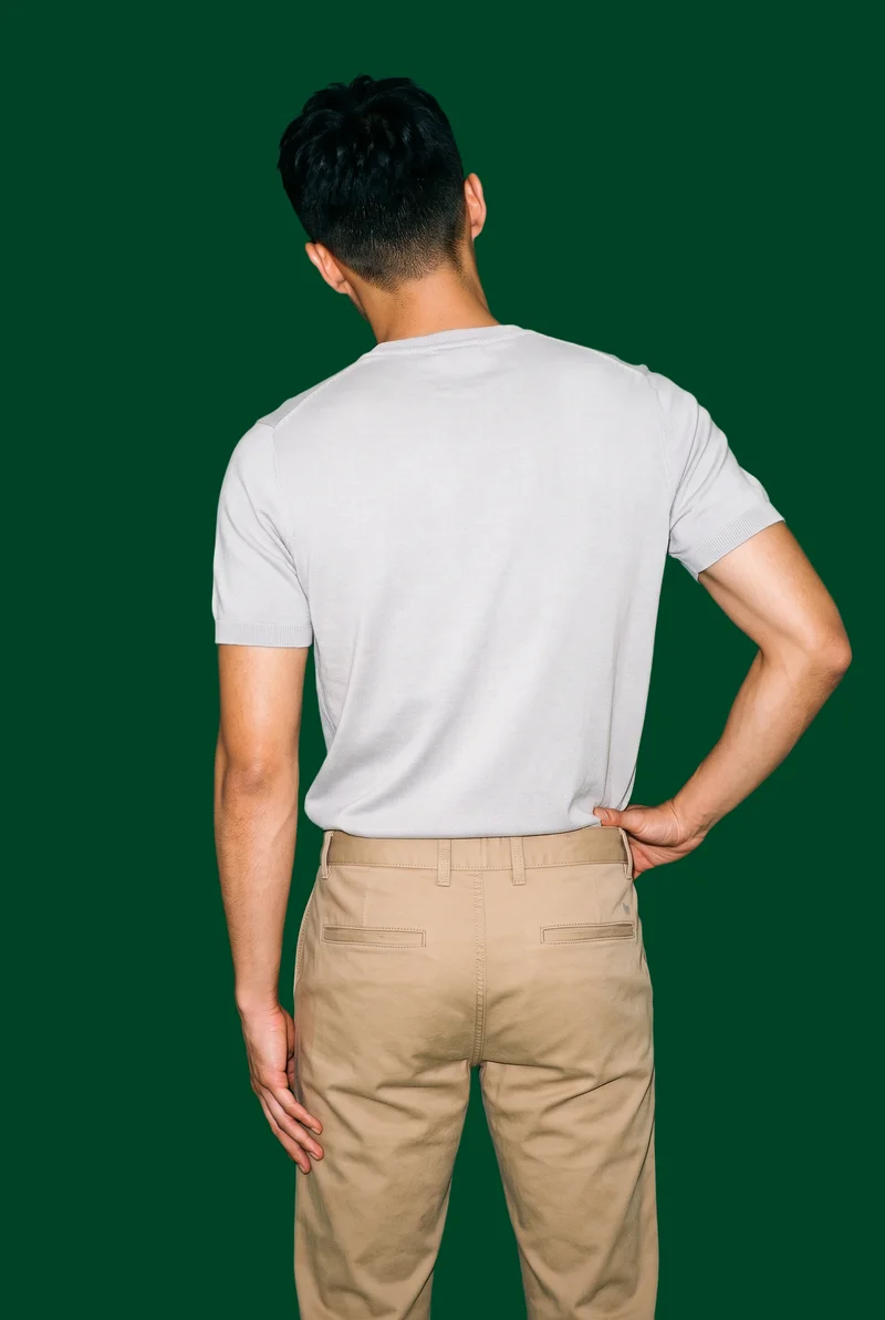 Men's Khaki Chinos, Three-quarter length at Back, Studio Cutout lighting
