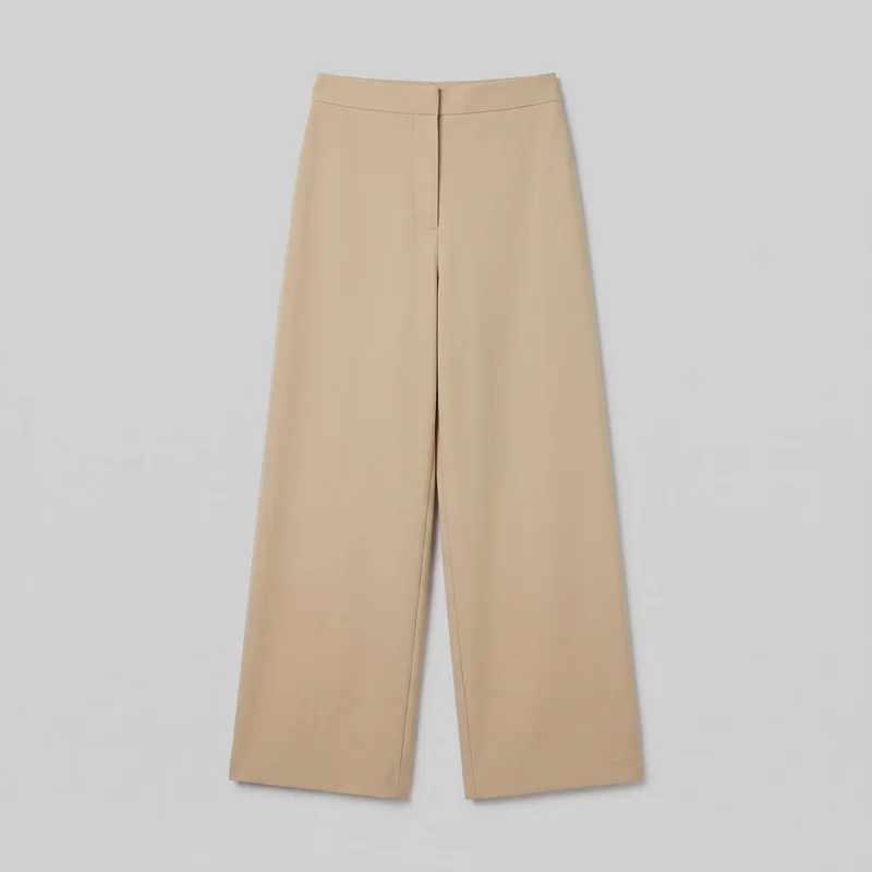 Beige tailored trousers shown in a mostly complete front flat-lay view. They have a structured waistband, clean flat front, concealed centered front placket, horizontal seam below the waistband, full-length wide straight legs, subtle inner-leg seams, and straight hems. No belt loops, pockets, logos, prints, patches, embroidery, or embellishments are visible.