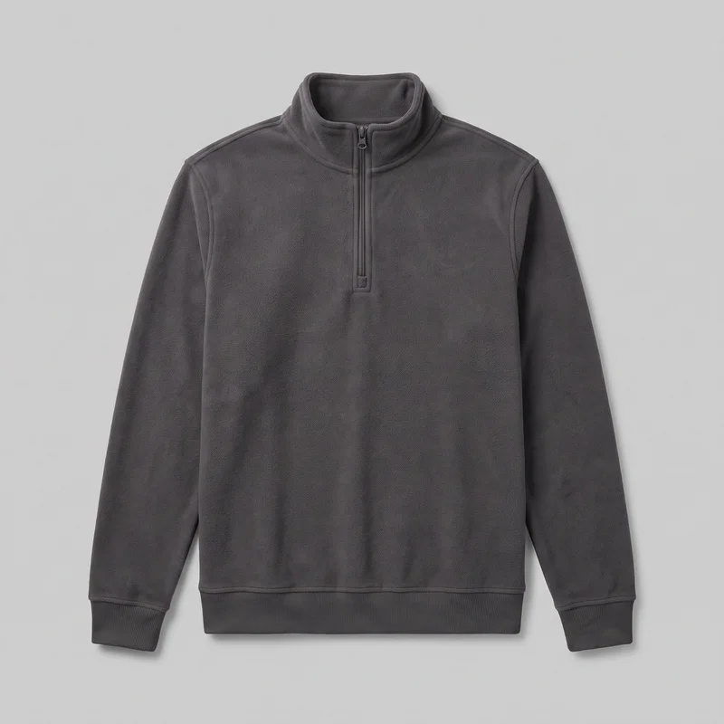 A full front view of a men's charcoal fleece quarter-zip pullover shown as a standalone product. The sweatshirt has long sleeves, a raised mock-neck collar, a centered short zipper placket with a visible pull, wide ribbed cuffs, and a wide straight ribbed hem. Its exterior is uniformly plush and textured, with no visible logos or embellishments.