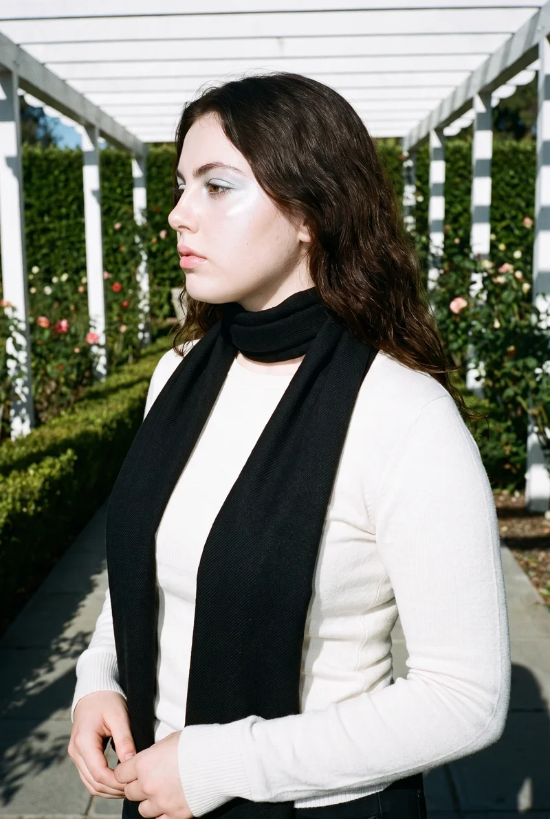 Women's Black Wool Scarf, Upper body at Side, Flash Editorial lighting
