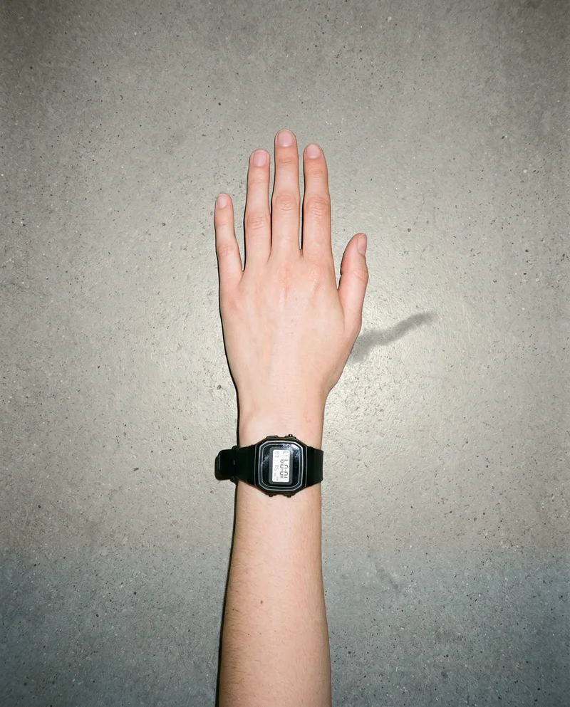 Women's Black Digital Sports Watch, Hand and wrist at Top, Natural E-Commerce lighting