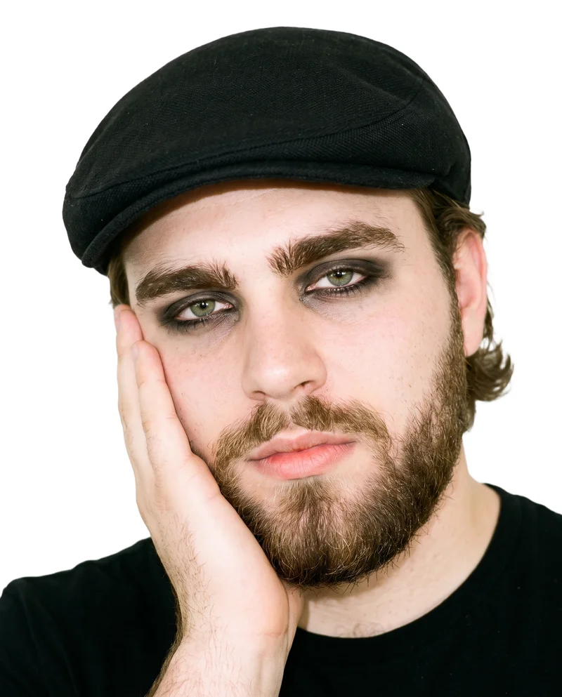 Men's Black Flat Cap, Head at Front, Studio Cutout lighting