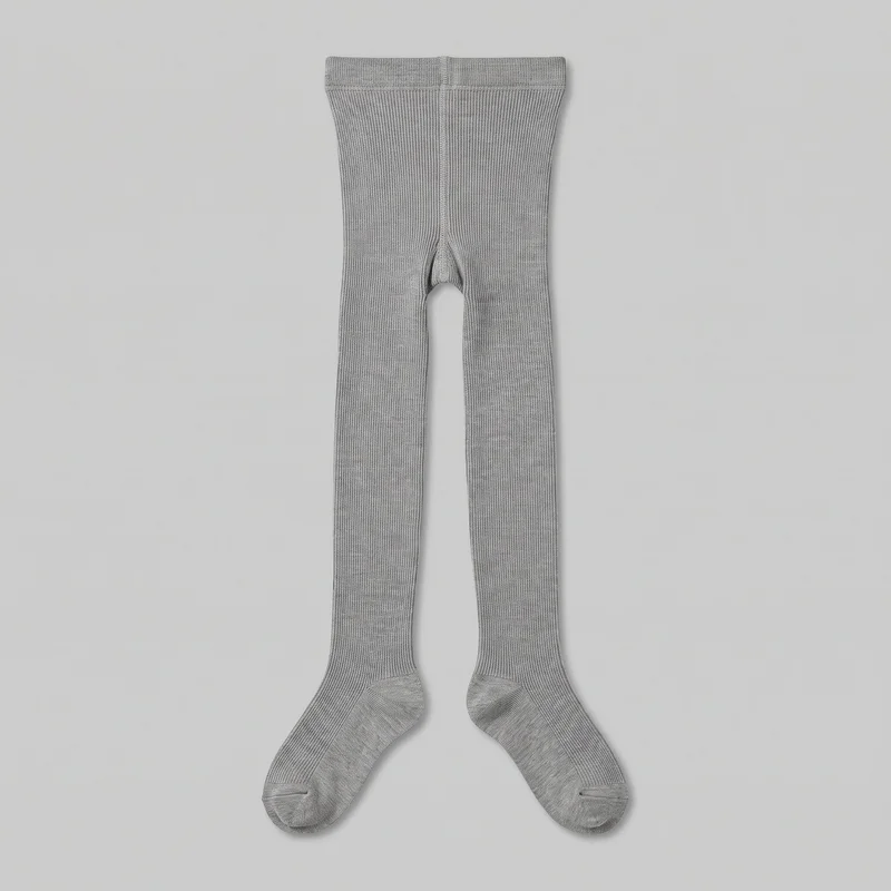 A full pair of grey ribbed footed tights is shown flat from the broad waistband to the enclosed toes. The tights have a high-rise, body-hugging silhouette, continuous fine vertical ribbing, a central crotch seam, shaped heels, and visible toe seams.