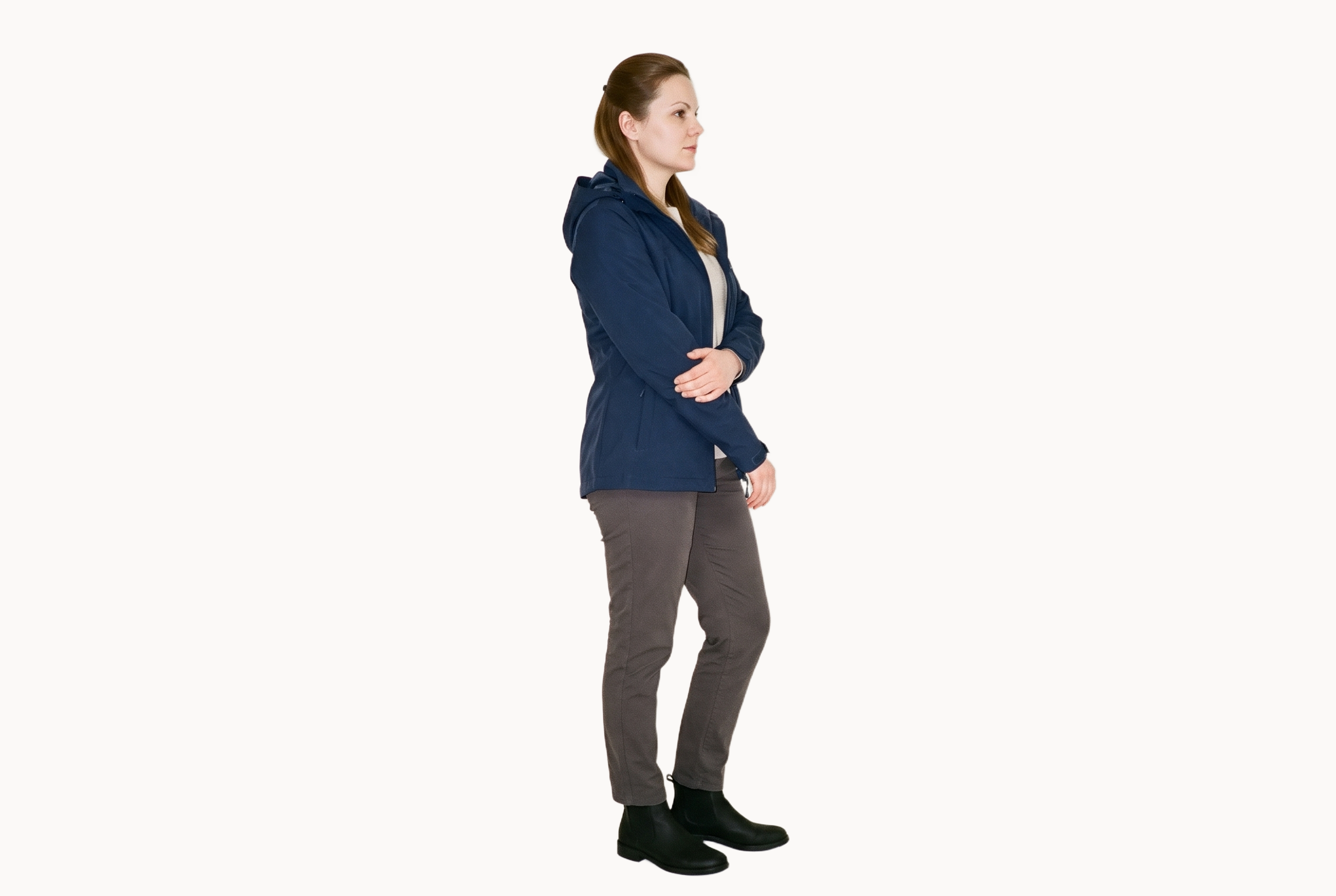A 36-year-old Caucasian woman wears a women's navy rain-shell jacket in a full-body side view, with her arms lowered and a natural expression. The Chantilly Lace flat-color backdrop provides a clean studio setting.
