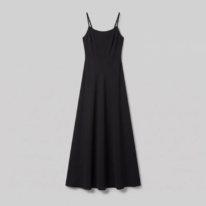 A black sleeveless camisole dress hangs flat in a mostly complete front view. It has narrow adjustable shoulder straps with visible slider hardware, a scoop neckline, a fitted bodice with a horizontal waist seam, and a long flared A-line skirt with a plain curved hem.