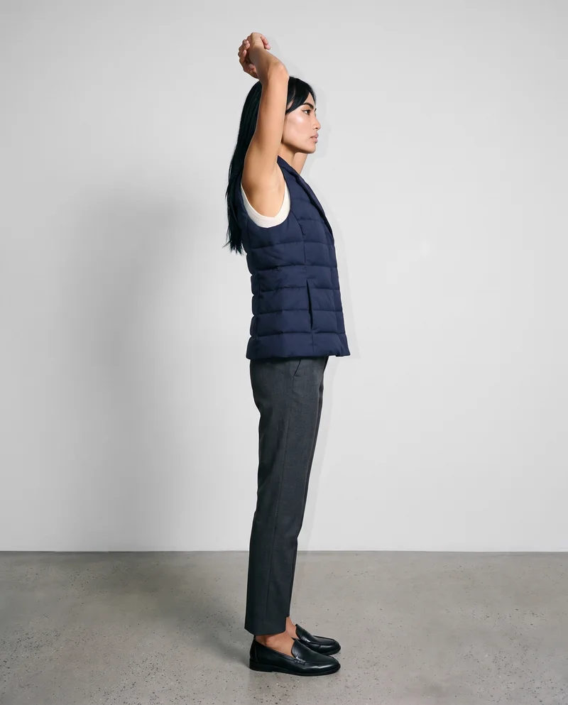 Women's Navy Padded Gilet, Full body at Side, Natural E-Commerce lighting