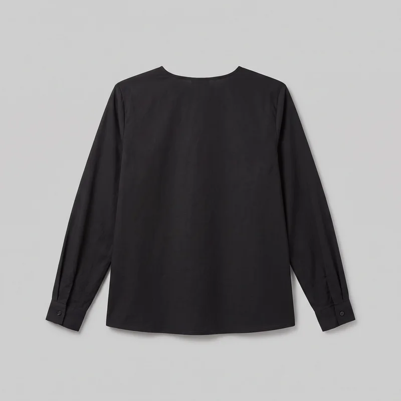 A black collarless blouse is shown as a standalone flat product view. It has a shallow round neckline, long sleeves with narrow buttoned cuffs and visible sleeve plackets near the wrists, set-in shoulders, a plain body, and a straight full-length hem.