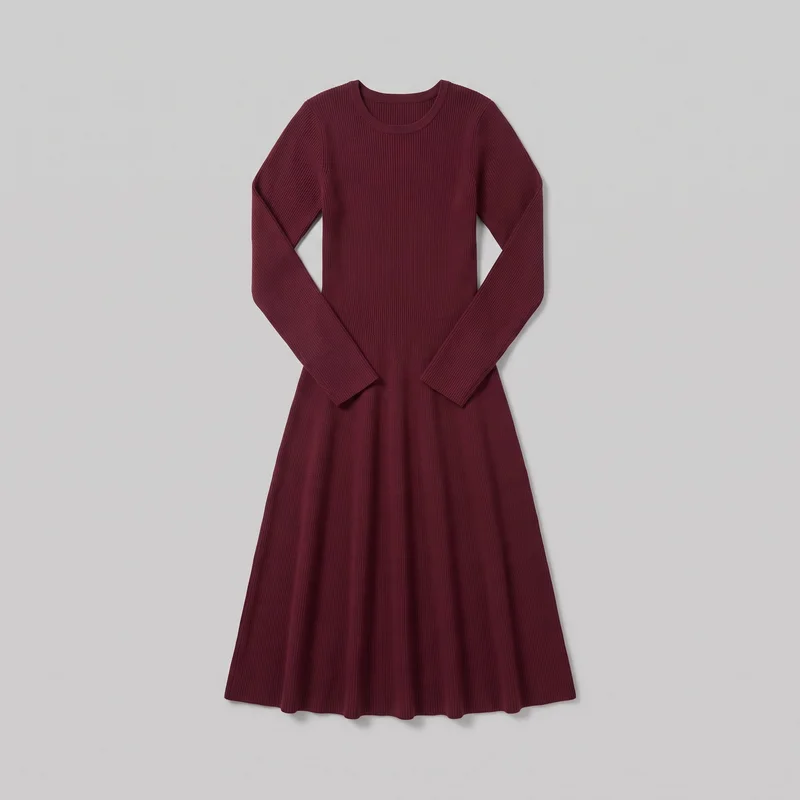 A complete front flat-lay view of a burgundy women's ribbed knit midi dress. It has a round crew neckline with a narrow ribbed neckband, set-in shoulders, full-length slim sleeves with plain cuffs, a fitted bodice, a defined waist seam, and a flared skirt with a softly wavy straight hem. Vertical ribbing runs throughout the dress, with no visible closures, pockets, logos, prints, embroidery, or embellishments.