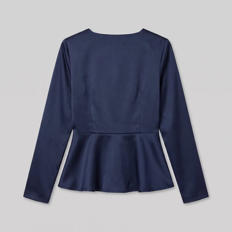 A navy satin women’s long-sleeve peplum top is shown flat from the front. The top has a shallow boat neckline, set-in shoulders, straight full-length sleeves with plain hems, a fitted bodice with vertical shaping seams, a horizontal waist seam, and a flared peplum panel ending in a clean curved hem.