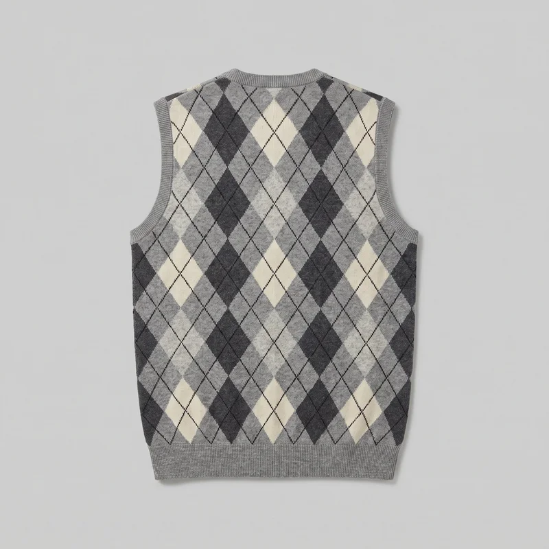 A mostly complete flat view of a men's grey sleeveless knit sweater vest with a high crew neckline, cutaway armholes, squared shoulders, and a straight full-width hem. Ribbed trim outlines the neckline, armholes, and wider bottom band, while contrasting diamonds and thin diagonal lattice lines form an all-over argyle pattern.
