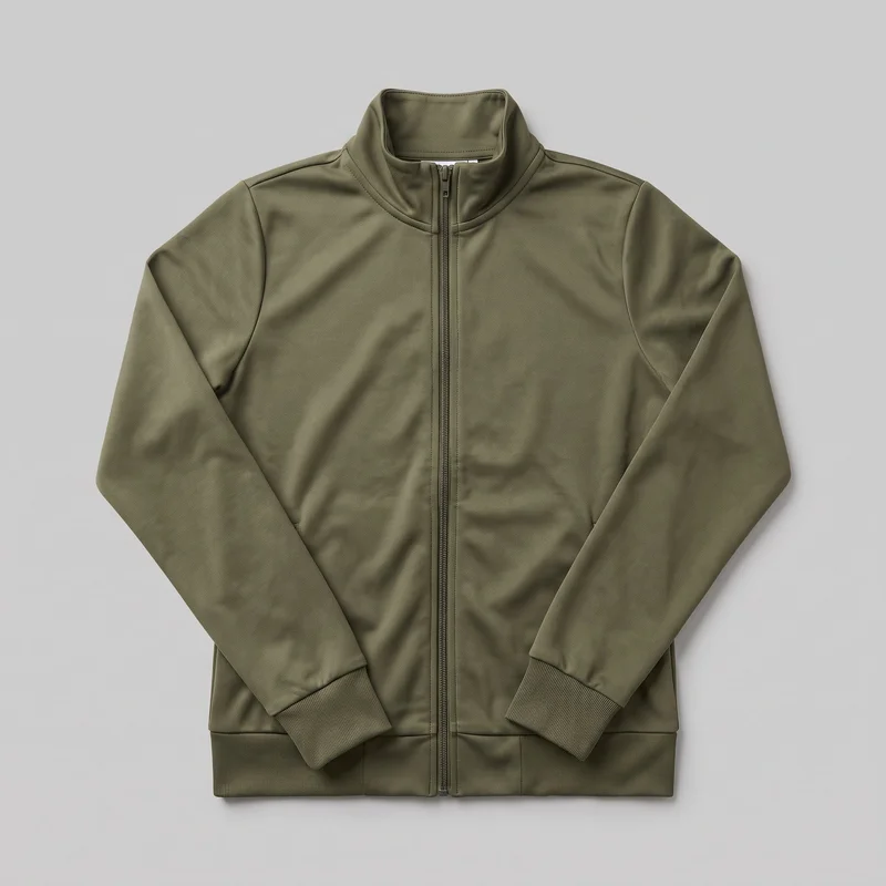 Women's olive tracksuit top shown as a mostly complete flat front product view. The regular-fit jacket has a full-length center zipper, high stand collar, long sleeves, ribbed cuffs, a ribbed waistband hem, and visible shoulder, sleeve, collar, and lower front panel seams.