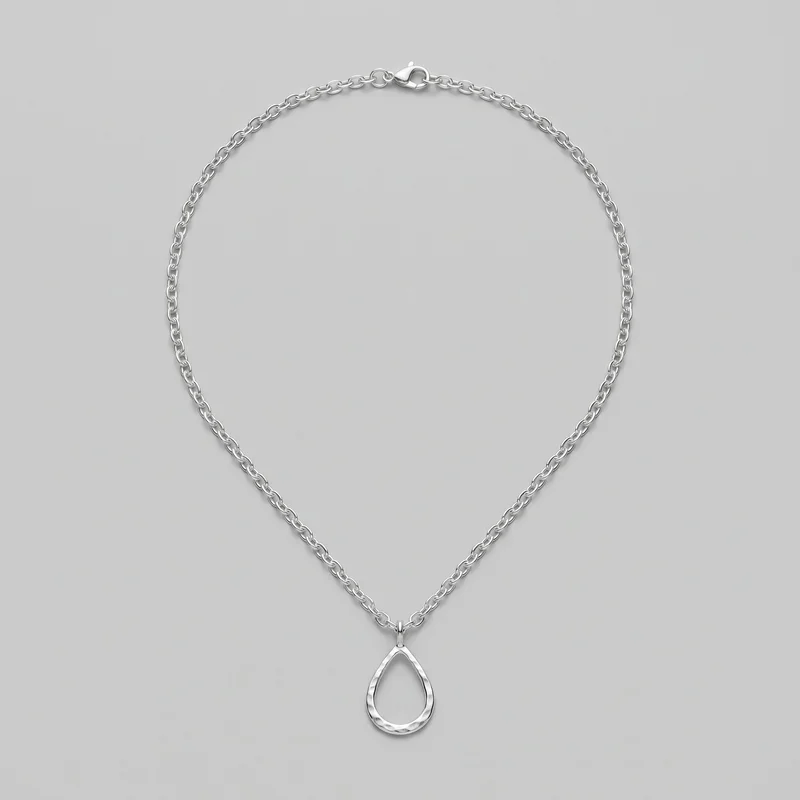 A silver single-strand pendant necklace is laid flat in a loop, with the lobster clasp and jump-ring connector at the top. An open teardrop-shaped pendant with an irregular hammered or faceted frame hangs centered at the bottom from a bail.