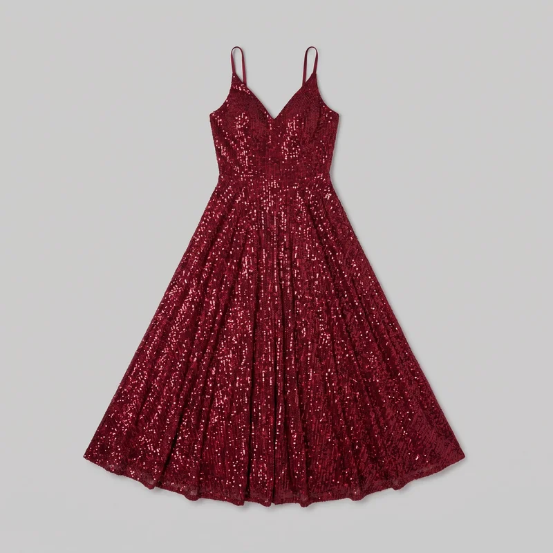 A red sleeveless evening gown is shown in a complete front-facing standalone view. The dress has narrow spaghetti straps, a deep V neckline, a tailored fitted bodice with shaped bust panels and visible vertical seams, a defined waist seam, and a full fit-and-flare skirt with soft vertical folds and gathered fullness extending to a floor-length hem. Dense sequins cover the exterior throughout, with no visible logos, patches, embroidery, or separate print motifs.