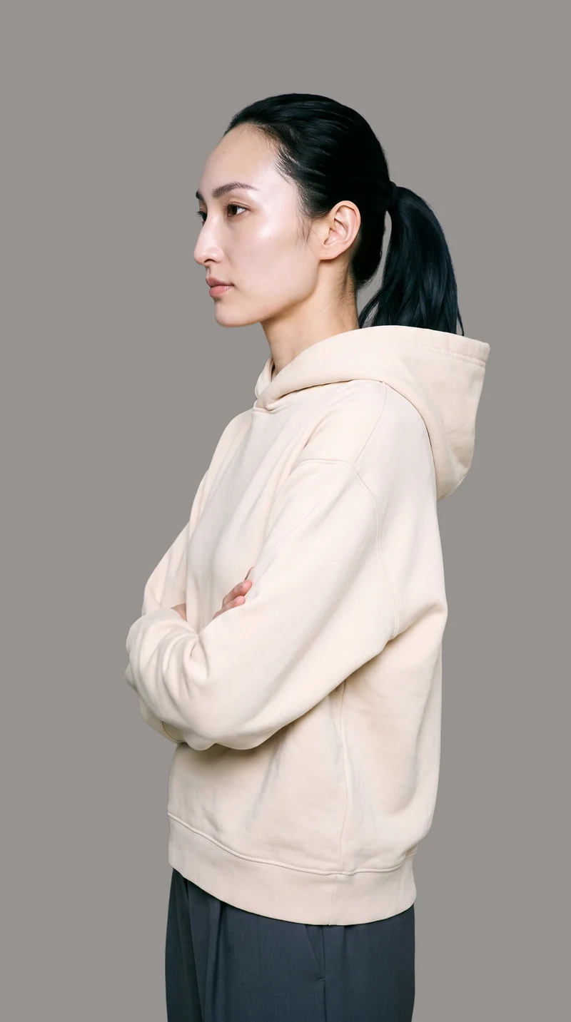 Women's Cream Pullover Hoodie, Upper body at Side, Studio Cutout lighting