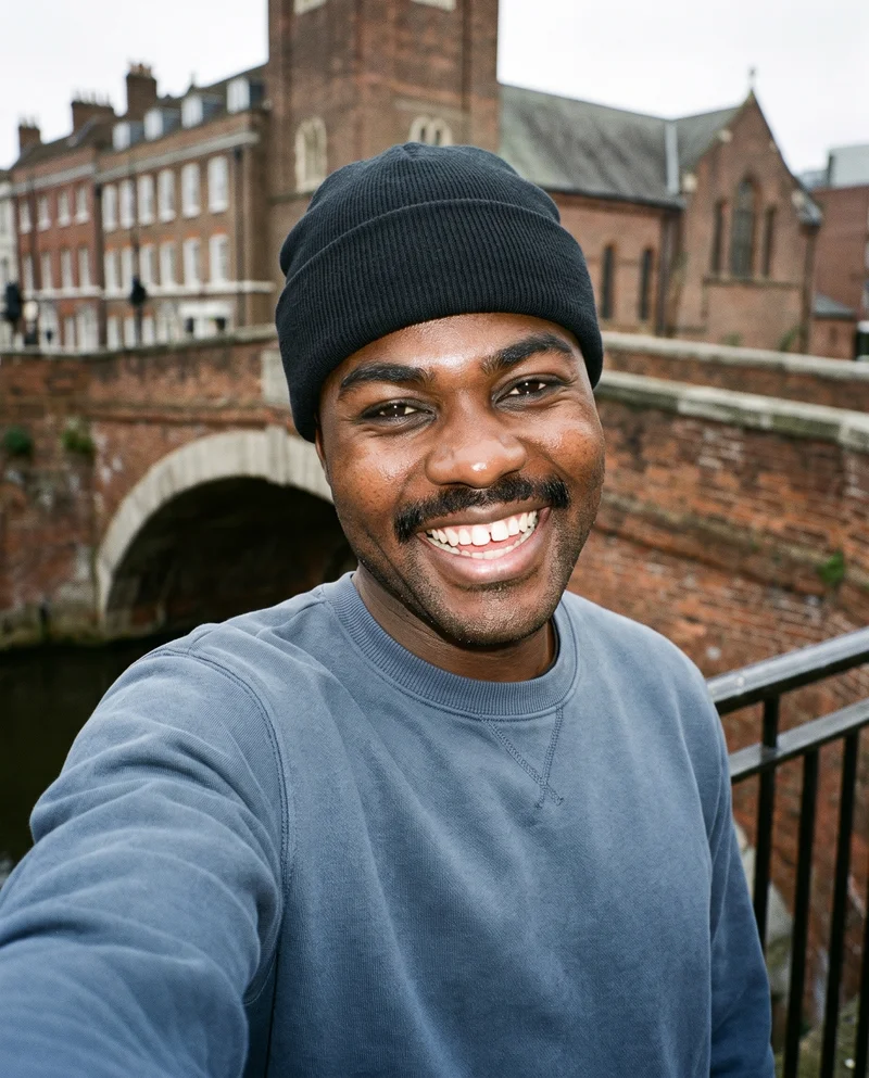Men's Black Knit Beanie, Selfie at Front, Natural E-Commerce lighting