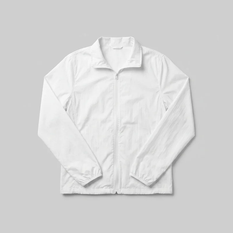 A mostly complete front flat-lay view of a women's white windbreaker jacket. It has a straight hip-length silhouette, long sleeves, an opened stand collar, a center zipper with a visible pull, curved vertical panel seams, elasticated-looking cuffs, and a stitched straight hem band. No logos, prints, patches, embroidery, or embellishments are visible.