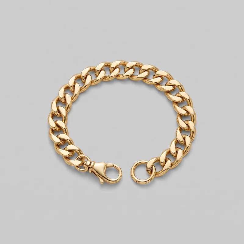 A gold curb chain bracelet is arranged in a near-circle as a standalone product, showing rounded, flattened interlocking oval links with smooth domed faces and open centers. The lobster-claw clasp and round connector ring are visible at the lower opening.