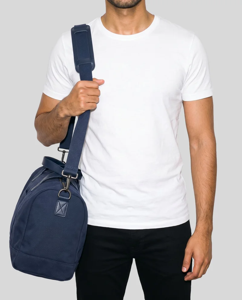 Navy Canvas Weekend Bag, Torso at Front, Studio Cutout lighting
