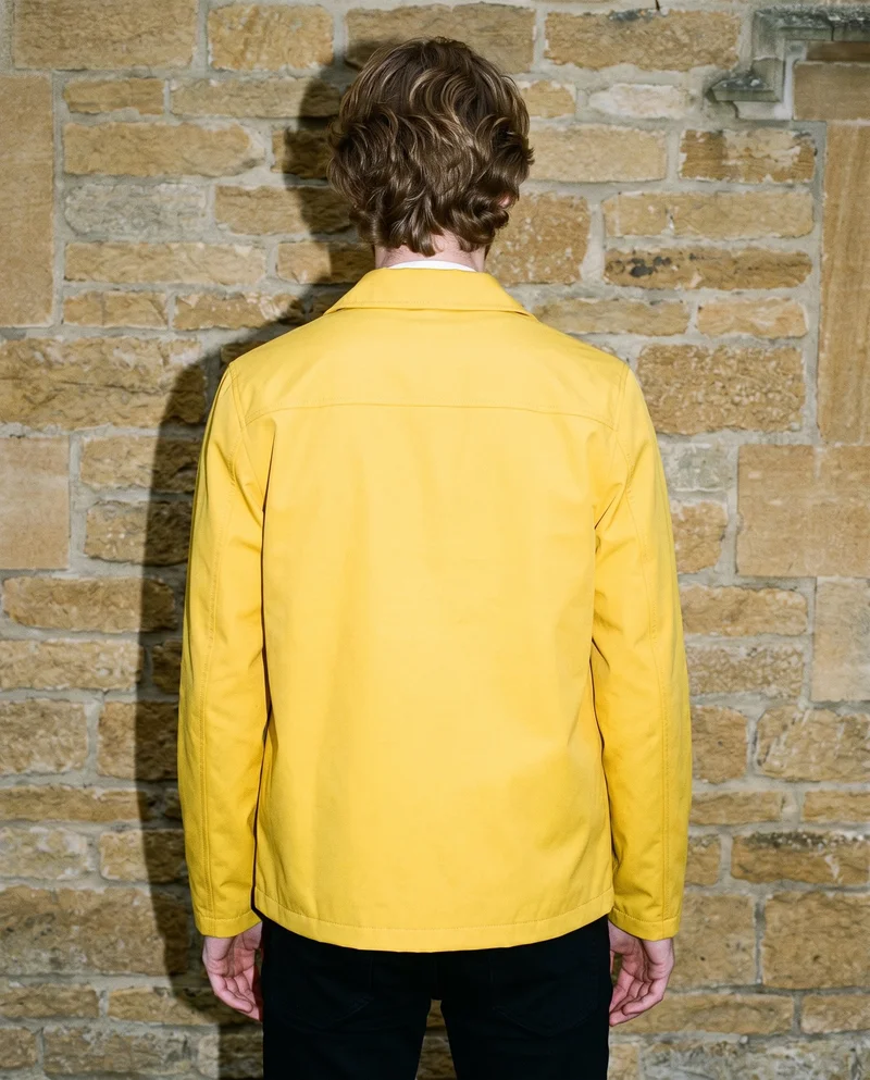 Men's Yellow Rain Mac, Upper body at Rear, Flash Editorial lighting