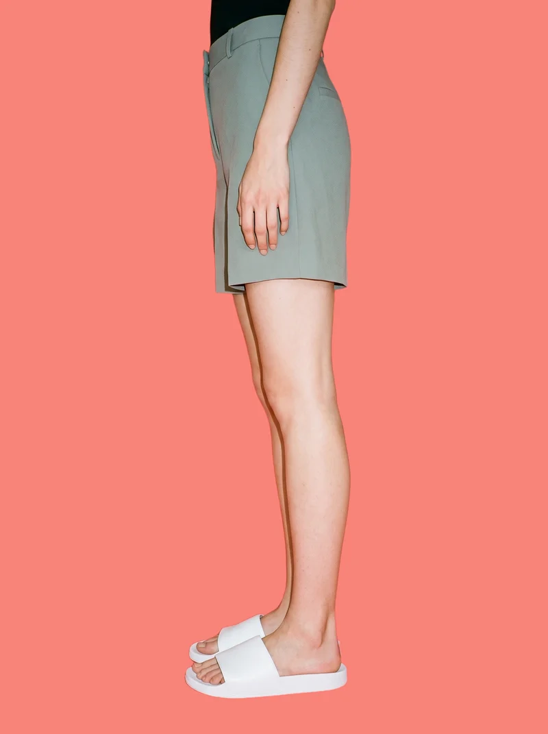 Women's White Sliders, Lower body at Side, Studio Cutout lighting