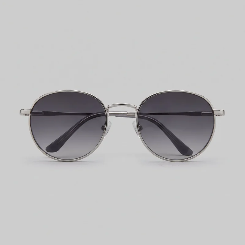 Round men's sunglasses shown alone in a front-facing view. The eyewear has full-rim circular lenses, a narrow double bridge with raised upper and straight lower connectors, clear adjustable nose pads, slim temples, and curved temple tips folded behind the lenses. No logos or other embellishments are visible.