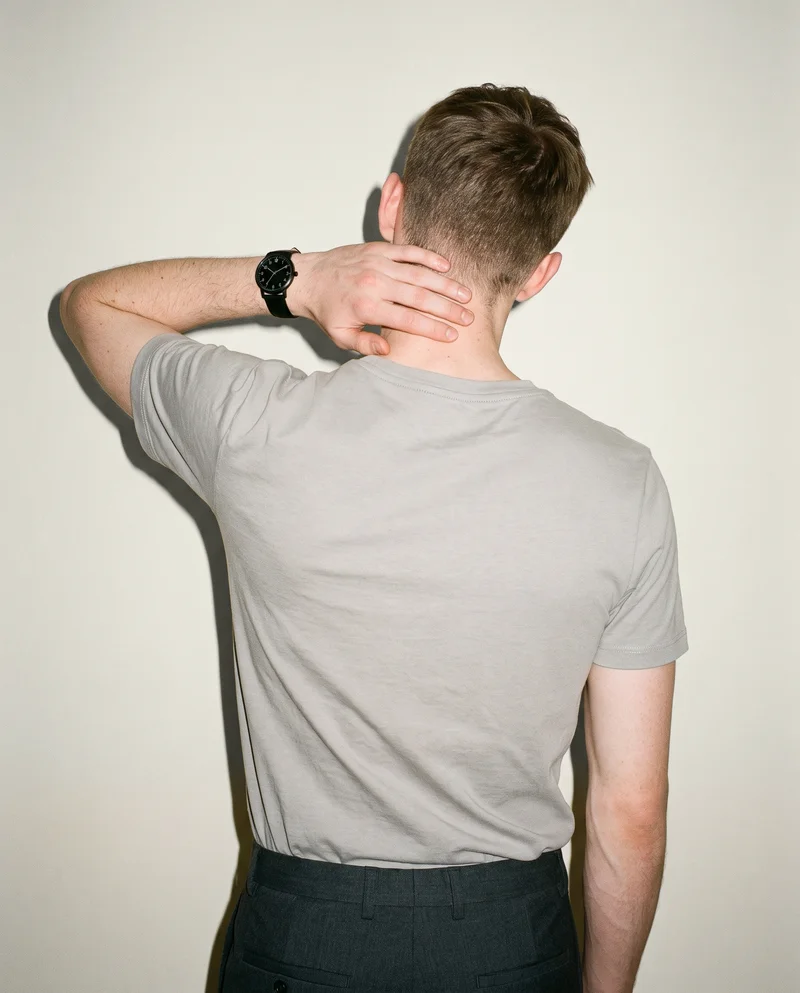 Men's Black Leather Dress Watch, Upper body at Back, Clean Catalog lighting