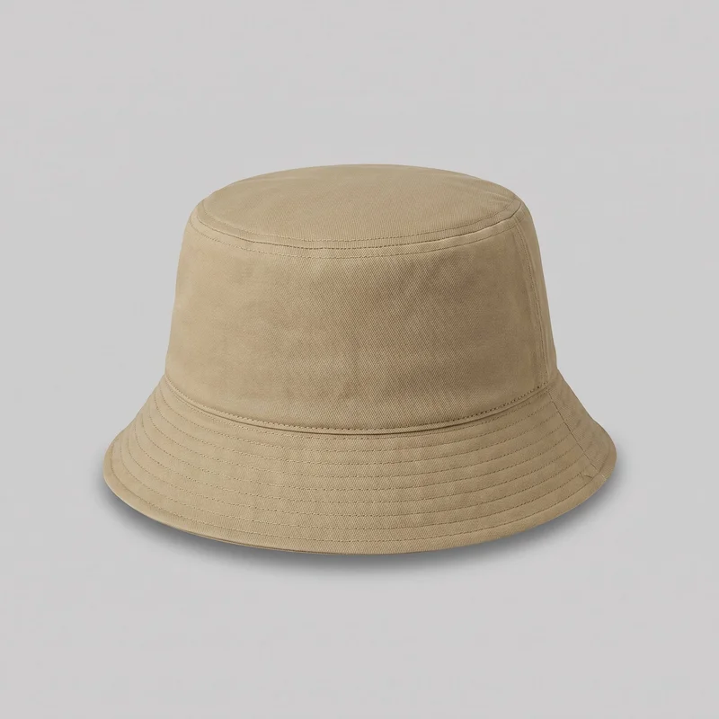 A standalone khaki bucket hat is shown from a slightly elevated front angle. It has a flat circular top panel, a slightly tapered crown with vertical seams, and a continuous downward-sloping brim finished with multiple concentric rows of topstitching and a bound outer edge. No logos, prints, patches, embroidery, closures, or other embellishments are visible.
