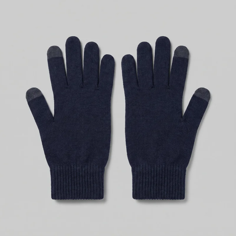 A pair of navy full-finger knit gloves is shown flat, with separate rounded fingers, angled thumbs, and straight ribbed cuffs extending past the wrists. The gloves have a fine allover knit texture and contrasting caps on select fingertips; no logos, prints, patches, embroidery, or embellishments are visible.