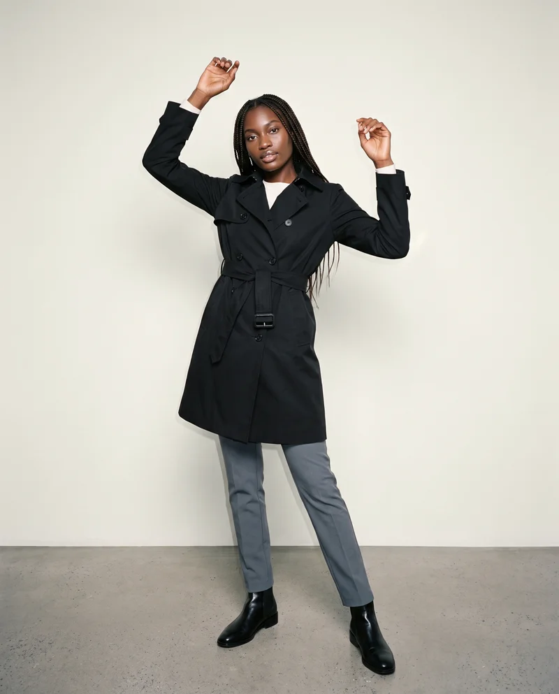 Women's Black Trench Coat, Full body at Three-quarter, Clean Catalog lighting