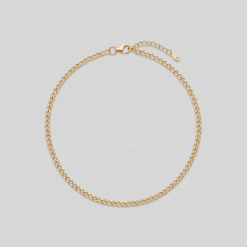 A women's gold chain necklace is arranged as a complete oval loop in a standalone view. The necklace has flattened interlocking curb links with no pendant or central charm; its lobster-claw clasp, round jump ring, adjustable extender chain, and flat teardrop-shaped end tab are visible near the top.