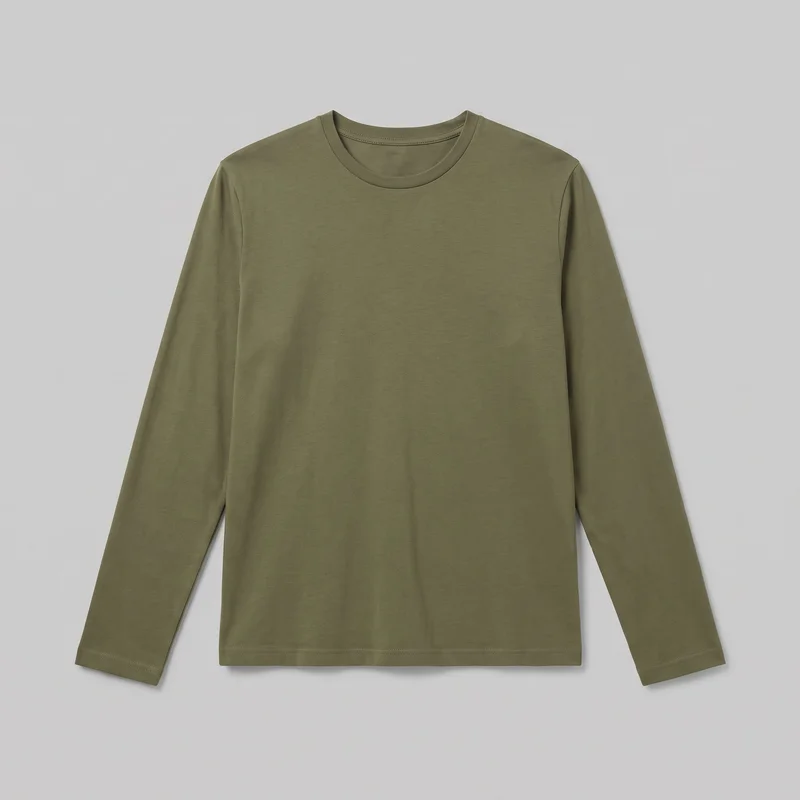 A plain olive cotton long-sleeve crewneck T-shirt is shown in a mostly complete front view, laid flat. It has a regular fit, straight body, set-in shoulders, full-length straight sleeves, a rounded crew neckline with a narrow bound band and visible stitching, stitched sleeve openings, and a straight stitched hem. No closures, pockets, logos, prints, patches, embroidery, or embellishments are visible.