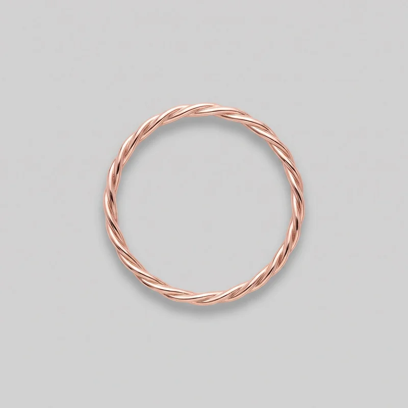 A complete rose gold stacking band ring is shown alone from above. Its rounded exterior forms a continuous circular silhouette with interlaced raised strands wrapping diagonally around the full band, separated by repeating recessed grooves; no stones, logos, or additional embellishments are visible.