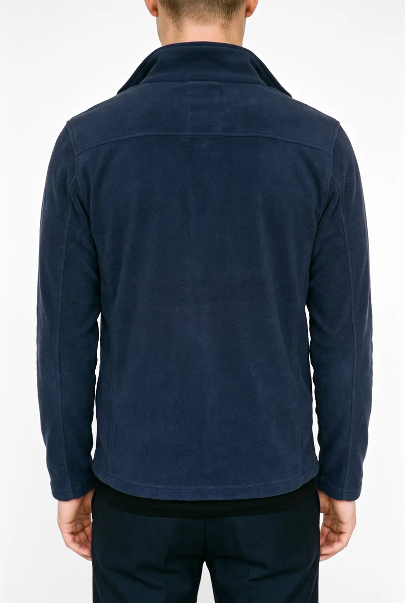 A men's navy zip-up fleece jacket shown on a male model from the rear, framed from the torso with his arms relaxed. The jacket is presented against a pure white studio backdrop.