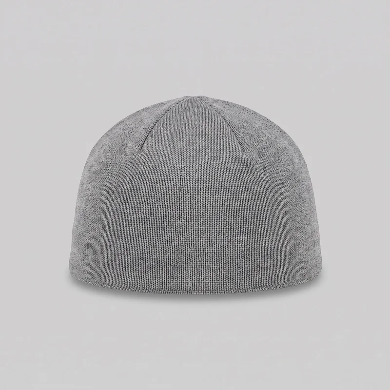 A standalone close view of a grey kufi cap. The close-fitting knit skull cap has a low rounded dome-shaped crown, a straight lower edge, all-over vertical ribbing, and curved crown seams radiating upward toward the top. No wearer, brim, closure, logo, print, patches, embroidery, or other embellishments are visible.