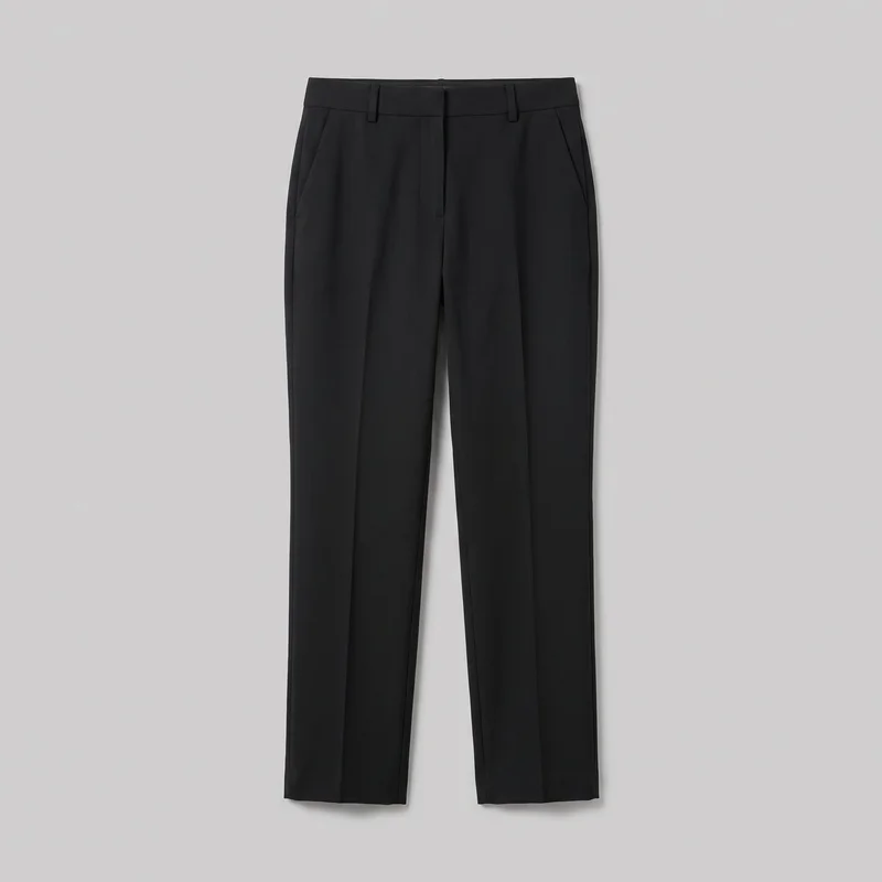 Women's black tailored straight-leg dress trousers are shown in a full front flat-lay view. The trousers have a flat waistband with belt loops, a front fly placket, angled slash pockets at both hips, pressed center creases, clean side seams, and plain straight hems.