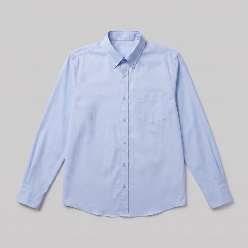 A light blue long-sleeve button-down shirt is laid flat in a mostly complete front view. It has a pointed button-down collar, full front button placket, set-in shoulders, cuffed sleeves, a single left chest patch pocket with angled lower corners, and a gently curved shirttail hem. Visible stitching follows the collar, placket, pocket, cuffs, sleeve seams, and hem; no logos, prints, embroidery, or embellishments are visible.