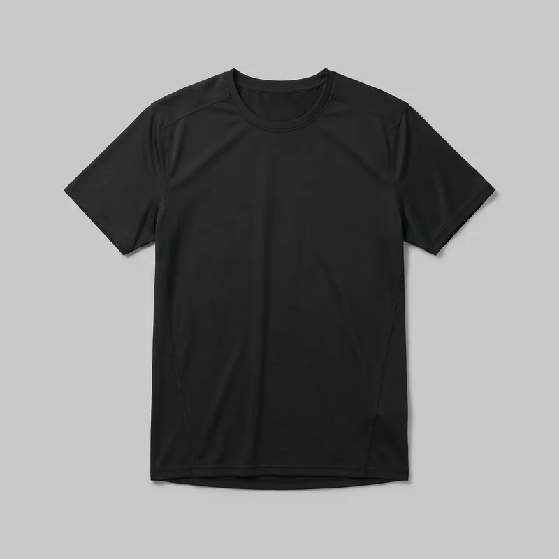 A black short-sleeve athletic crewneck T-shirt is laid flat in a mostly complete front view. The shirt has a regular, slightly tapered silhouette, a bound crew neckline, curved shoulder and side-panel seam lines, and double-stitched sleeve and bottom hems. Its front hem is mostly straight, with a slightly curved lower layer visible behind it; no closures, pockets, logos, prints, patches, embroidery, or embellishments are visible.
